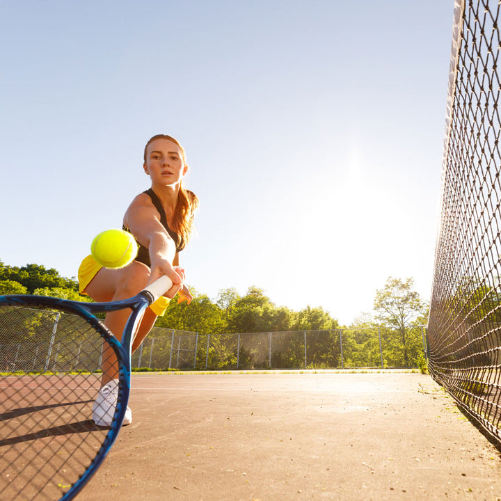 Woman playing tennis, hitting tennis ball with tennis racquet #1-wahle-dein-profil_high