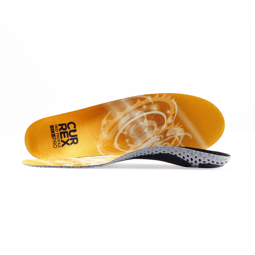 View of pair of yellow medium profile BIKEPRO insoles, one standing on side to show top of insole, second insole set in front showing its profile while toe is facing opposite direction #1-wahle-dein-profil_med