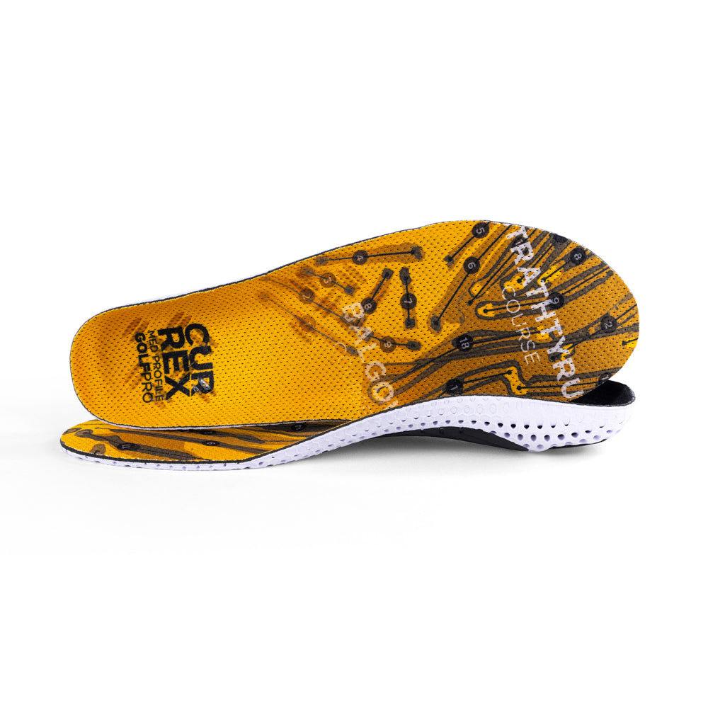View of pair of yellow medium profile GOLFPRO insoles, one standing on side to show top of insole, second insole set in front showing its profile while toe is facing opposite direction #1-wahle-dein-profil_med