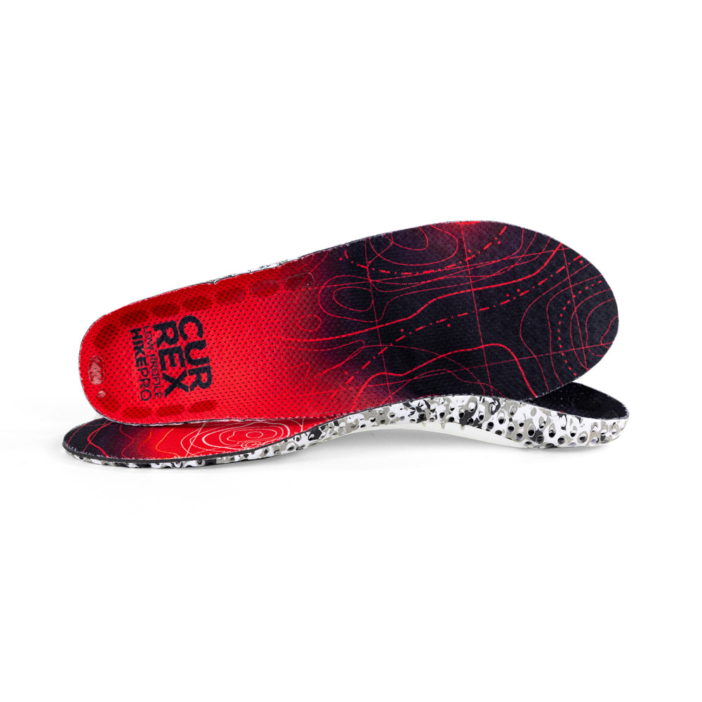 View of pair of red low profile HIKEPRO insoles, one standing on side to show top of insole, second insole set in front showing its profile while toe is facing opposite direction #1-wahle-dein-profil_low