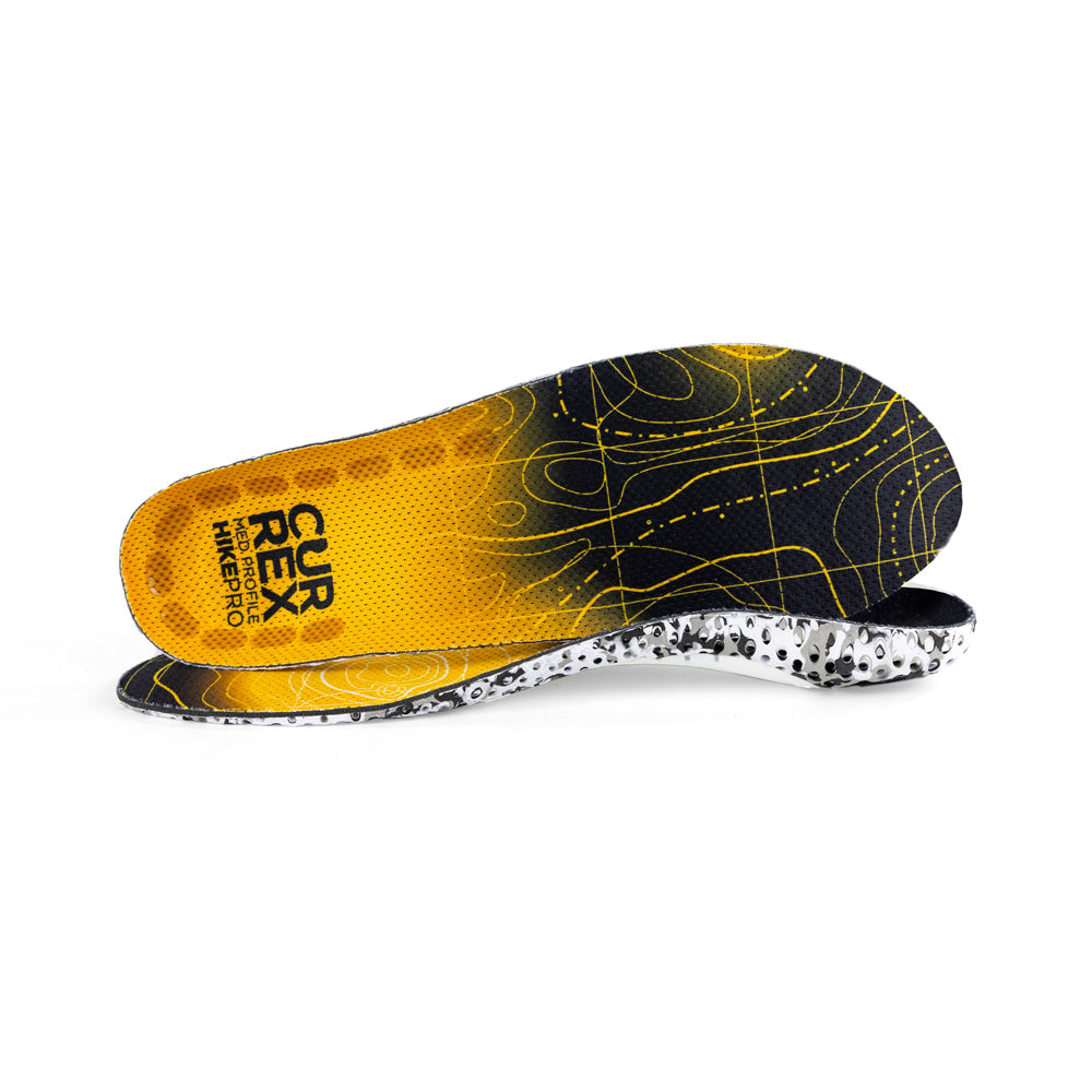 View of pair of yellow medium profile HIKEPRO insoles, one standing on side to show top of insole, second insole set in front showing its profile while toe is facing opposite direction #1-wahle-dein-profil_med